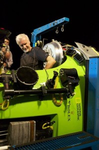 Filmmaker and National Geographic Explorer-in-Residence James Cameron slides into the hatch of the DEEPSEA CHALLENGER submersible as he prepares for his record dive to the bottom of the Mariana Trench (AP Photo/National Geographic, Mark Thiessen)