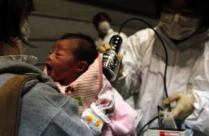 Nagashima Rio, who was born four days after the 2011 Fukushima earthquake and tsunami, is tested for possible nuclear radiation at a local evacuation center.  (REUTERS/Kim Kyung-Hoon)