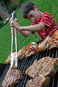 Boy cooks a steak (Photo: woodleywonderworks via Flickr/Creative Commons)
