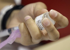A syringe is used to draw H1N1 swine flu vaccine. (Photo: AP Photo/Alex Brandon)
