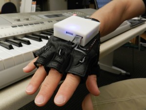 The Mobile Music Touch is a wireless, musical glove that may improve sensation and motor skills for people with paralyzing spinal cord injury.   (Photo: Georgia Institute of Technology)