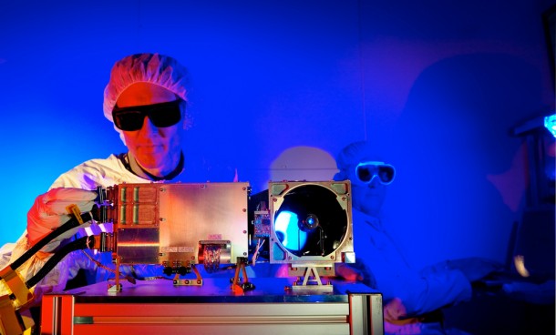 A technician tests a component of the Curiosity rover's ChemCam unit, which will help identify rock and soil targets on Mars. (Photo: LeRoy Sanchez/NNSA-USDOE)