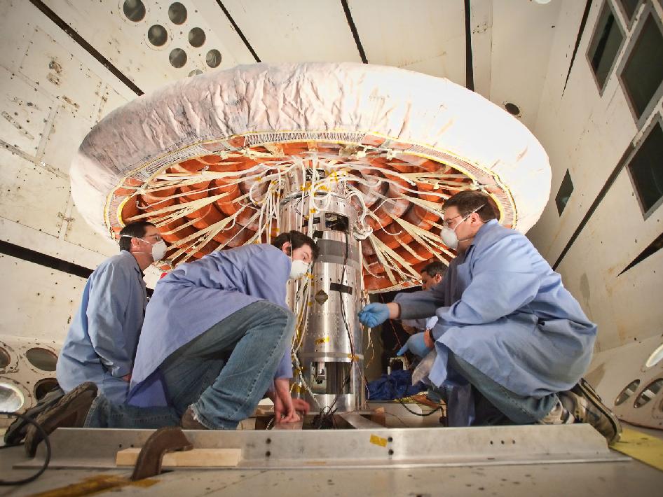 Engineers checking out the Inflatable Reentry Vehicle Experiment (IRVE-3) at NASA’s Langley Research Center in Hampton, Va.  (Photo: NASA Langley/Sean Smith)