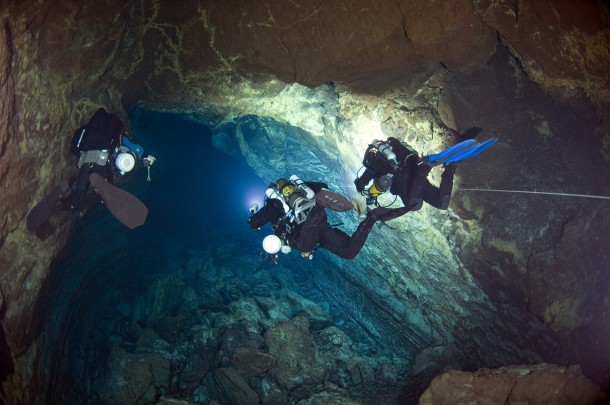 Cave divers exploring a submarine lava tube cave in the Canary Islands for a National Science Foundation-supported expedition,"Survey of Anchialine Cave Fauna of the Bahama Islands" (Photo: Jill Heinerth/NSF)