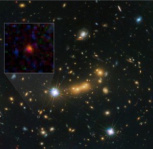 Composite image of the newly discovered galaxy - MACS0647-JD. The inset at left shows a close-up of the young dwarf galaxy. (Photo: NASA, ESA, & M. Postman and D. Coe (STScI) and CLASH Team)