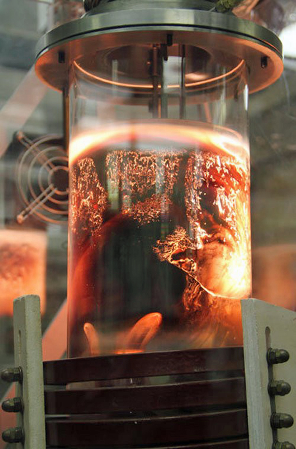 Scientists at the U.S. Department of Energy’s (DOE) Ames Laboratory are working to more effectively remove a rare earth element (group of closely related metallic elements) called neodymium from the mix of other materials in a magnet.  Here rare-earth magnet scraps are melted in a furnace with magnesium. (Photo: DOE/Ames Laboratory)