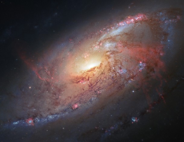 Using data from the Hubble Space Telescope this is an assembled photo illustration of the magnificent spiral galaxy M106. (Image: R. Gendler/NASA)