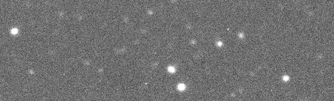 This animated set of images depicts asteroid 2012 DA14 as it was seen on 02-14-13, at a distance of 748,000 kilometers. The asteroid is the large bright spot moving near the middle of image. The other dots are stars in the background. A line that appears comes from a satellite that passed through the field of view.(Image credit: LCOGT/E. Gomez/Faulkes South/Remanzacco Observatory)