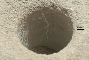 View into one of the drillholes in Martian mudstone made by Curiosity in the Yellowknife Bay area of Gale Crater. A sample of powdered material from the rock was used to determine the age of the rocks. (NASA/JPL-Caltech/MSSS)