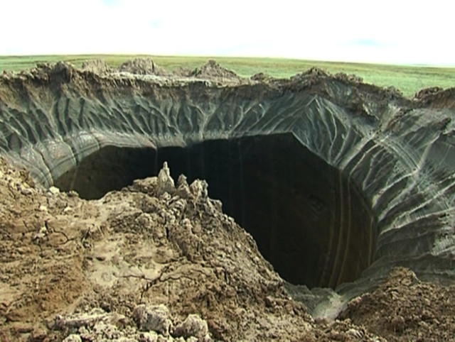 On July 17, 2014 Russian scientists said that they believe that changing temperatures may be responsible for creating this 60-meter wide crater that was recently discovered in far northern Siberia.  Scientists from the Scientific Research Center of the Arctic developed the theory since they found that 80% of the giant crater is made of ice and that there were no traces of an explosion, which eliminated a meteorite strike as its origin. (AP)