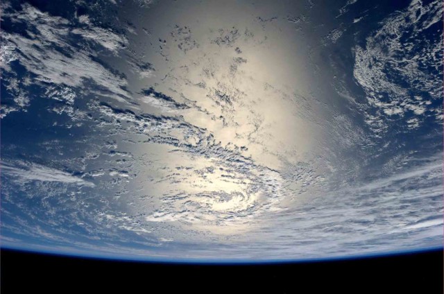 German astronaut and photo bug Alexander Gerst, currently a crewmember aboard the ISS, Tweeted another spectacular photo from space on July 17, 2014.  Here you see the Earth as the Sun’s light reflects off the water. (Reuters/NASA) 