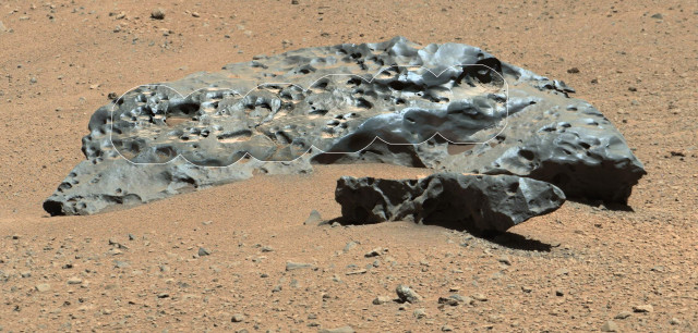 Officials with NASA’s Curiosity mission on July 15, 2014 released a photo of this rock that the Mars rover encountered in its travels across the Red Planet.  Scientists said the rock is actually an iron meteorite.  The scientists named the meteorite "Lebanon". (NASA)