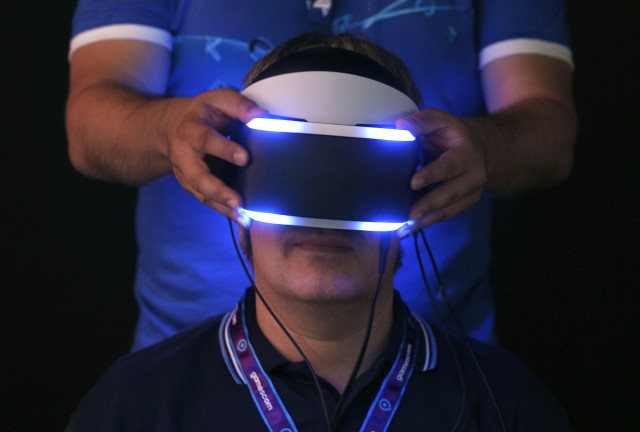 A man attending Gamescom 2014, Europe’s largest video games trade show, is shown here trying on Sony’s “Project Morpheus” virtual reality headset.  Gamescom 2014 runs through Sunday, August 17, 2014 in Cologne, Germany.  (Reuters) 