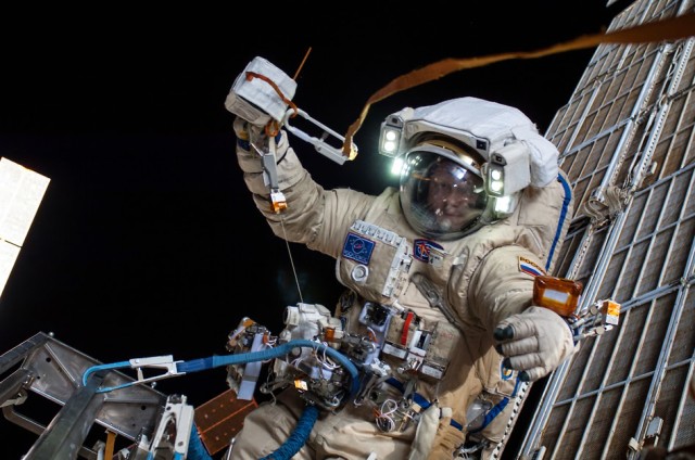 Russian cosmonaut Oleg Artemyev, a flight engineer aboard the International Space Station is shown here conducting extravehicular activity (EVA).  Artemyev and fellow cosmonaut Alexander Skvortsov conducted a little space station maintenance, deployed a small science satellite, and installed experiment packages.  The spacewalking cosmonauts also inspected components on the space station’s exterior. (NASA)