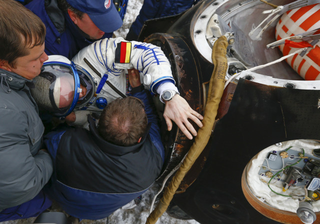 After spending 5 ½ months in orbit aboard the International Space Station, crew member Alexander Gerst of Germany is seen here being helped out a Soyuz TMA-13M space capsule after safely landing in a remote area in northern Kazakhstan November 10, 2014. Gerst returned to Earth with his fellow crewmembers Maxim Suraev of Russian and Reid Wiseman from the United States. (Reuters)