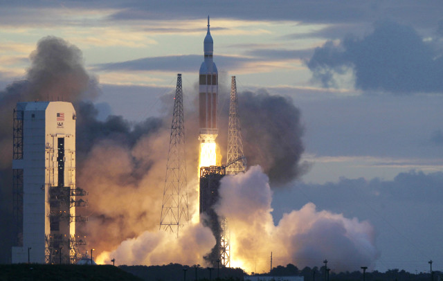 NASA sent its new Orion capsule, atop a Delta IV rocket, into space on its first unmanned orbital test flight on 12/5/14.  NASA hopes to use the new space capsule in the future for manned flights to an asteroid or perhaps even Mars. (AP/NASA)