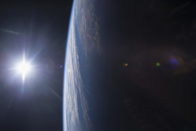 This amazing photo of the sun setting (left) over the Gulf of Mexico and the U.S. Gulf Coast (right) from space was posted to social media by the crew of the International Space Station on 12/14/14.  (Reuters/NASA) 