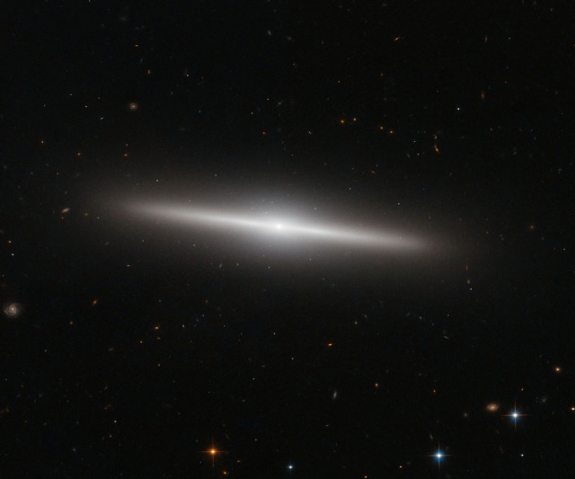 NASA and the European Space Agency released this new Hubble Space Telescope image of the galaxy IC 335 on 12/24/14.  The IC 335 galaxy is located in the Fornax Galaxy Cluster, which is about 60 million light-years away. (ESA/Hubble/NASA)