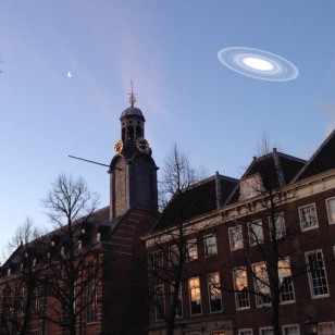 The rings around J1407b are so large that if they were put around Saturn, we could see the rings at dusk with our own eyes and camera phones. Here the rings as they would be seen in the skies of Leiden, above the Old Observatory and the Academic Building. (M. Kenworthy/Leiden)