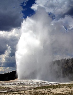 One of the most popular hydrothermal features at Yellowstone park is the geyser Old Faithful, shown here during one of its regular eruptions. (Jon Sullivan/Wikimedia Commons)