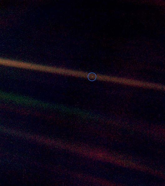 Carl Sagan's tiny "pale blue dot" (in circle) is a photo of Earth taken by the Voyager 1 space probe from a distance of about 6 billion kilometers (NASA via Wikimedia)