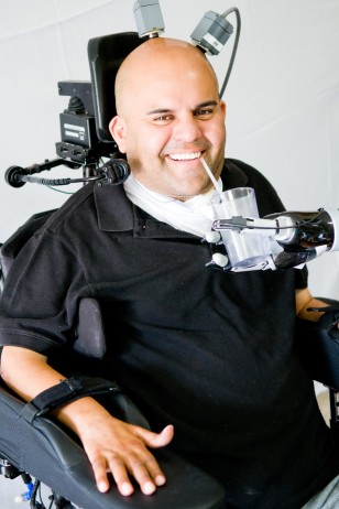 Using his mind and imagination Erik Sorto was able to control a robotic arm, which made it possible to give himself a drink for the first time in 10 years (Spencer Kellis & Christian Klaes/Caltech)