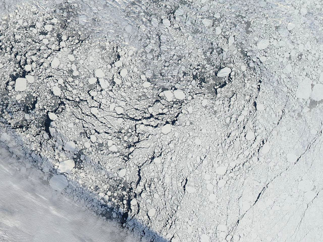 An image of an area of the Arctic sea ice pack well north of Alaska, captured by the MODIS instrument on NASA's Aqua satellite on Sept. 13, 2013 (NASA)