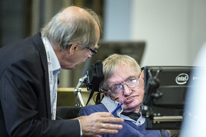 Nobel physics laureate Gerard 't Hooft, of Utrecht University, the Netherlands, confers with Stephen Hawking after the Cambridge professor presented his solution to the information loss paradox. Hawking is in town for a weeklong conference on the information loss paradox, which is co-hosted by Nordita at KTH Royal Institute of Technology. (Håkan Lindgren/KTH Royal Institute of Technology)