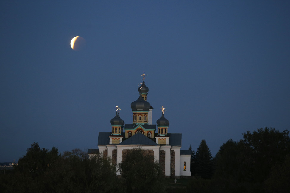 A perigee full moon or supermoon is when a full moon makes its closest approach to Earth during its elliptical orbit.  Skywatchers were treated to a rare combination of a supermoon and a total lunar eclipse on 9/27/15.  Here’s a look at the supermoon behind an Orthodox church in Belarus as it nears the end of the eclipse.  (AP)