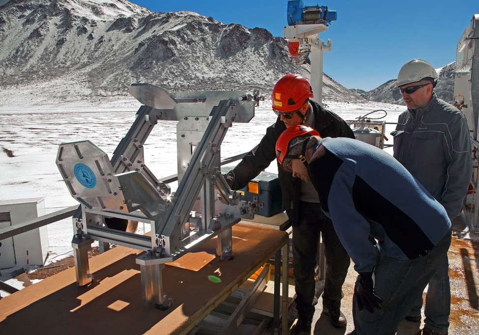 In this photo released  11/4/15 by the European Southern Observatory, engineers from Onsala Space Observatory's Group for Advanced Receiver Development are seen here examining the top part of the Swedish-ESO PI receiver for APEX (SEPIA) before its installation at on the Atacama Pathfinder Experiment (APEX) telescope in Chile. (ESO/Sascha Krause)