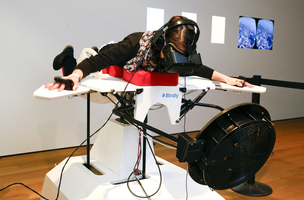 A visitor tries the flight simulator ‘Birdly’ at the exhibition "Animated Wonderworlds" at Zurich’s Museum for Design, 11/17/15. Birdly simulates the flight of a red kite over New York City, controlled by the entire body of the user. The flight simulator was developed by scientists at Zurich University of the Arts. (Reuters)