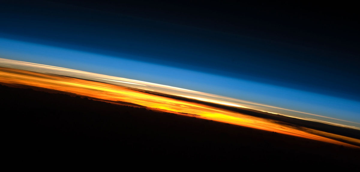 A view of Earth's atmosphere at sunset as seen by the International Space Station Expedition 23 crew in 2010. Colors here roughly denote the various layers of the atmosphere. (NASA)