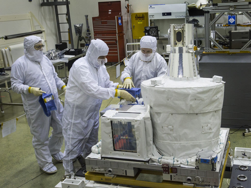 Technicians inside a clean room at NASA's Langley Research Center, in Virginia, prepare the Stratospheric Aerosol and Gas Experiment III (SAGE III) instrument for shipment to NASA's Kennedy Space Center on 11/24/15. The ozone and aerosol-measuring instrument is set for a March 2016 launch to the International Space Station.  (NASA)