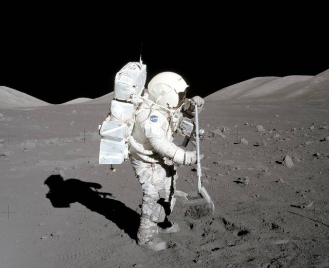 Apollo 17 astronaut Harrison H. Schmitt collects samples of lunar rocks and rock chips. Material gathered in this and other Apollo missions revealed presence of radioactive iron isotopes from a supernova explosion. (NASA)