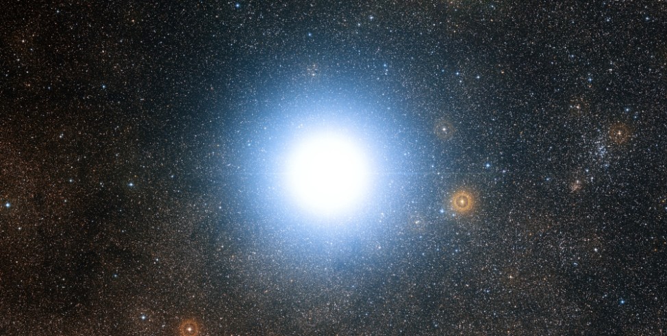 This wide-field view of the sky around the bright star Alpha Centauri was created from photographic images forming part of the Digitized Sky Survey 2. (European Southern Observatory)