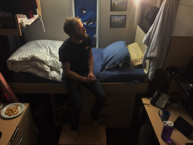 A new foot stool in use--the author enjoys the smooth, sanded, stained finish with his bare feet