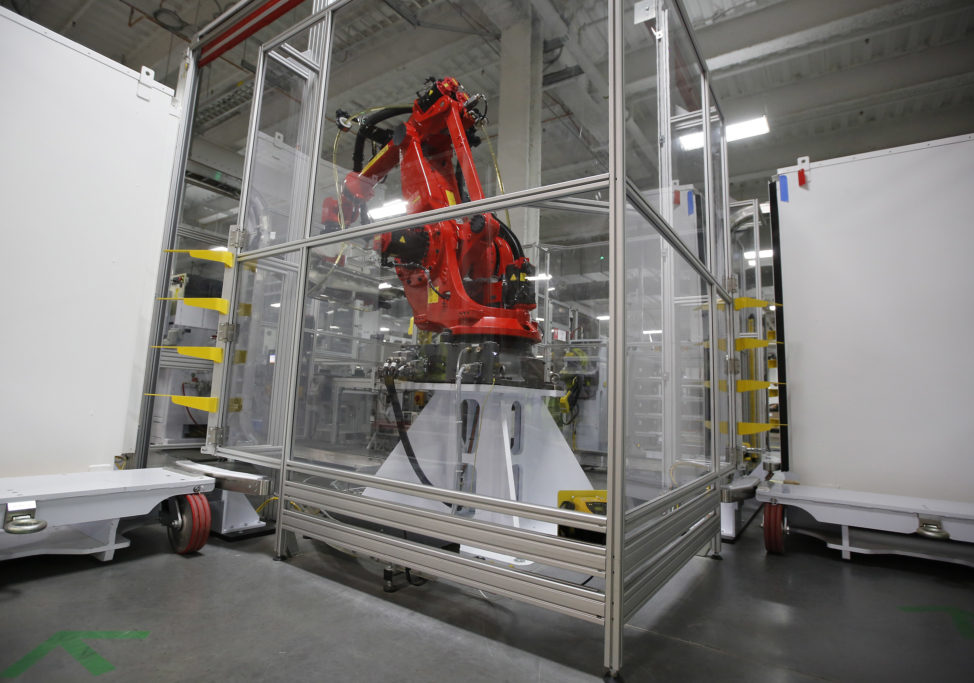 A robot that will be used to produce lithium-ion batteries at the new Tesla Motors Inc., Gigafactory is displayed on 7/26/16, in Sparks, Nev. (AP) 