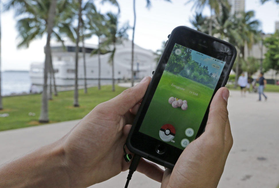 Pokemon Go the smartphone game application released on 7/6/16 has already become a worldwide phenomenon. Here a Pokemon Go player finds Exeggcute, a Pokemon, at Bayfront Park in Miami, FL on 7/12/16. (AP)