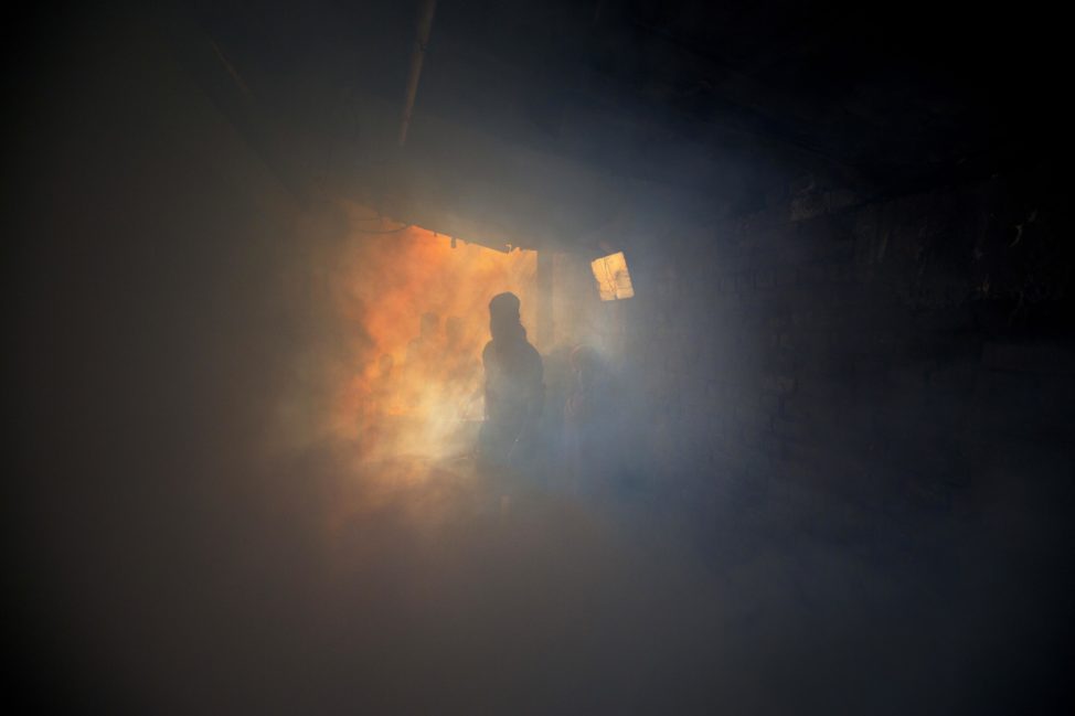 A municipal worker fumigates an alley in an impoverished area to prevent the spread of mosquito-borne diseases in New Delhi, India 9/2/16. Scientists say that 2.6 billion people living in parts of Asia and Africa could be at risk of infection by the Zika virus. (AP)