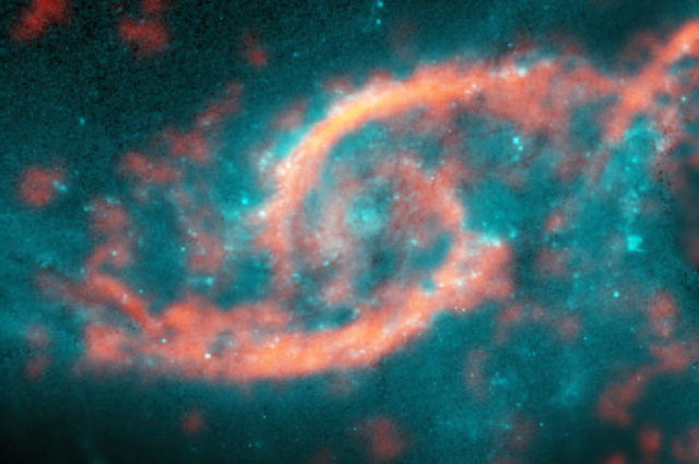 Dazzling eyelid-like features bursting with stars in galaxy IC 2163 formed from a tsunami of stars and gas triggered by a glancing collision with galaxy NGC 2207 (a portion of its spiral arm is shown on right side of image). ALMA image of carbon monoxide (orange), which revealed motion of the gas in these features, is shown on top of Hubble image (blue) of the galaxy. Credit: M. Kaufman; B. Saxton (NRAO/AUI/NSF); ALMA (ESO/NAOJ/NRAO); NASA/ESA Hubble Space Telescope)
