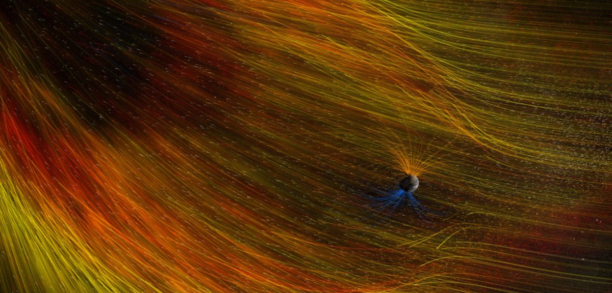 Illustration of Earth as its bombarded with high-energy particles from the Sun's coronal mass ejection. Our planet's magnetic field acts like a shield protecting the planet against harmful radiation. (NASA/Goddard Space Flight Center)