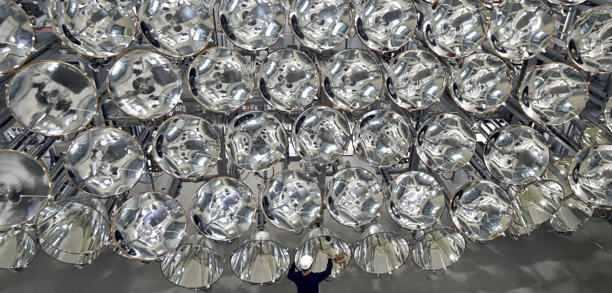 Engineer Volkmar Dohmen stands in front of a giant bank of xenon short-arc lamps at the DLR German national aeronautics and space research center in Germany. When switched on, what is being called the world’s largest artificial sun creates combined intensity that's 10,000x stronger than sun's light on Earth's surface and produces temperatures of around 2,982° Celsius. The photo was taken on 3/21/17 (AP)