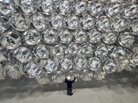 Engineer Volkmar Dohmen stands in front of a giant bank of xenon short-arc lamps at the DLR German national aeronautics and space research center in Germany. When switched on, what is being called the world’s largest artificial sun creates combined intensity that's 10,000x stronger than sun's light on Earth's surface and produces temperatures of around 2,982° Celsius. The photo was taken on 3/21/17 (AP)