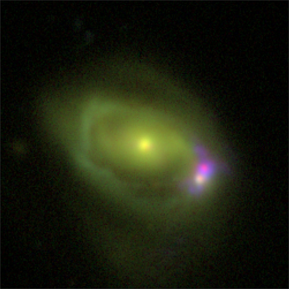 This image, released by NASA on 3/30/17, shows the Was 49 system, a large disk galaxy, merging with a much smaller "dwarf" galaxy Was 49b. The image was compiled using observations from the Lowell Observatory’s Discovery Channel Telescope in Happy Jack, Arizona. The same color filters used by the Sloan Digital Sky Survey was used to help create the image. (DCT/NRL)