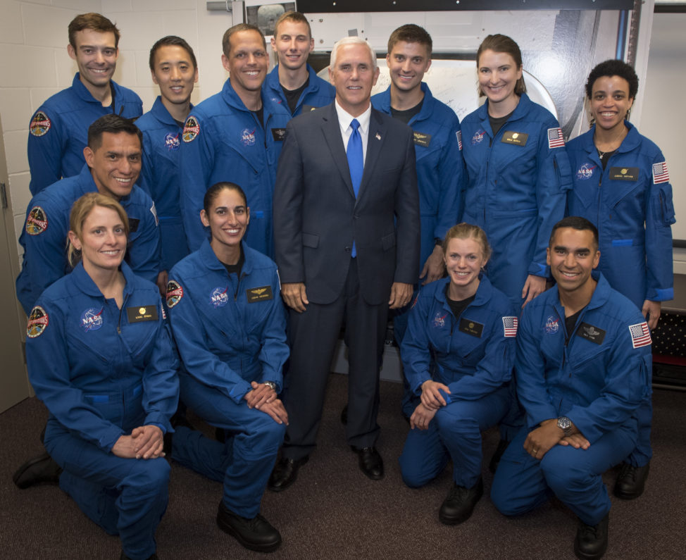 On June 7, 2017, U.S. Vice President Mike Pence is seen here with NASA's 12 new astronaut candidates at NASA's Johnson Space Center in Houston, Texas. NASA waded through its biggest applicant pool ever to select seven men and five women for its astronaut corps. (NASA via AP)