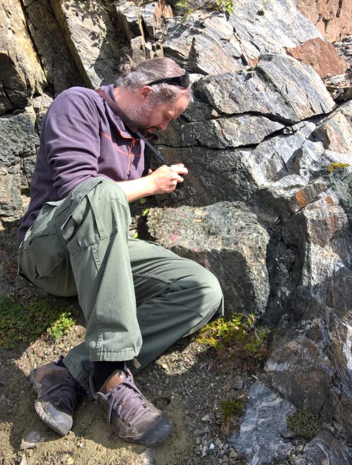 Matthijs Smit of the University of British Columbia examines ancient rocks from the deep crust in Norway during the summer of 2017. (Matthijs Smit)