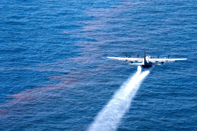 A C-130 Hercules from the Air Force Reserve Command's 910th Airlift Wing at Youngstown-Warren Air Reserve Station, Ohio, drops an oil-dispersing chemical into the Gulf of Mexico May 5, 2010, as part of the Deepwater Horizon Response effort. (Technical Sergeant Adrian Cadiz/US Air Force)