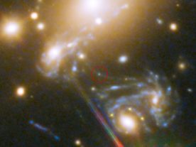Galaxy cluster MACS J1149.5+223. Highlighted is the position where the star LS1 appeared — its image magnified by a factor 2000 by gravitational microlensing.(NASA, ESA, S. Rodney (John Hopkins University, USA) and the FrontierSN team; T. Treu (University of California Los Angeles, USA), P. Kelly (University of California Berkeley, USA) and the GLASS team; J. Lotz (STScI) and the Frontier Fields team; M. Postman (STScI) and the CLASH team; and Z. Levay (STScI))