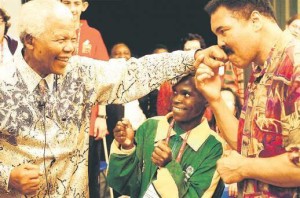 Nelson Mandela spars playfully with Muhammad Ali