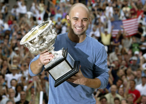 Andre Agassi lifts the Australian Open trophy for a fourth time in 2003. Photo: Reuters